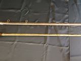 two old swords are laying on a black cloth