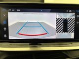 a picture of a car ' s rear view mirror showing a basketball court