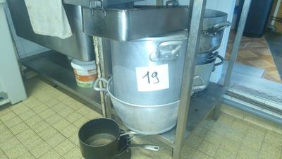 an image of a kitchen with a pot and a kettle on the floor