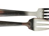 two forks that are sitting next to each other