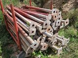a pile of old rusty pipes sitting in the grass
