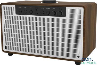 an image of a brown and white radio sitting on top of a table
