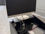 a desk with a keyboard, mouse, and monitor on it