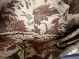 a close up of a purse with a floral pattern