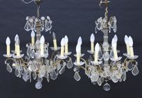 Paire de lustres corbeille à huit bras de lumière en bronze …