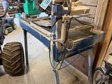 a man that is working on a machine in a garage