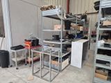 a room filled with lots of metal shelves and shelves