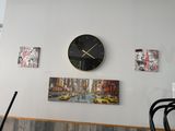 a clock that is on the wall of a restaurant