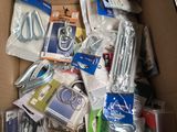 a cardboard box full of electronics and other items