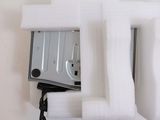 a microwave sitting in the middle of a white wall