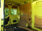 a yellow van that has been vandalized and is in the process of remodeling