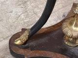 a small table with a brass plate on it