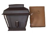 a brown lantern with a brown bag next to it