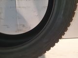 a close up of a tire on a white surface