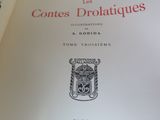 an open book with a picture of a coat of arms on it