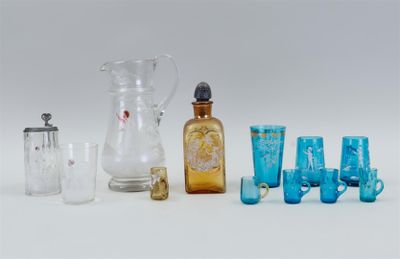 a group of glass items including a pitcher, glass cups, and a glass jug