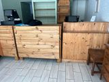 a desk with a computer on top of it in a room