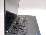 a laptop computer that is open on a white surface