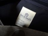 a close up of a label on a black bag