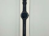 a close up of a watch in a box on a white surface