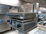 an image of a commercial kitchen with stainless steel appliances