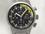 a silver watch with a black face and a yellow second hand
