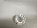 a small glass object on a table with a stick in it