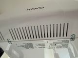a close up of a white microwave on a table