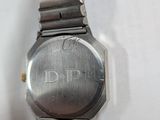 a close up of a wrist watch on a white surface