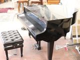 a piano that is sitting in the middle of a room