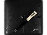 a pen that is laying on top of a black case