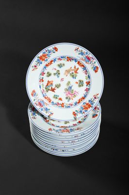 several plates are stacked on top of each other on a black surface