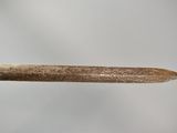 a small piece of wood that has been cut in half