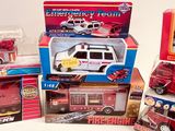 many different types of toy fire trucks in the box