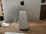 an apple computer sitting on a desk with a keyboard and mouse