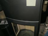 a black stove with a white label on it