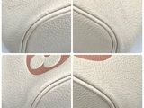 four photos of the inside of a white purse