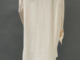 an image of a mannequin wearing a white shirt and white pants