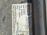 a parking ticket on the ground next to the curb