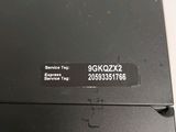 the back of a black laptop with a sticker on it