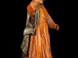an image of a statue of a man holding a book
