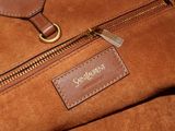 the brown bag is sitting on the table with the name of the bag