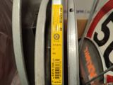 a close up of a yellow sticker on the side of a bicycle tire