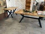 two tables that are sitting next to each other on the floor
