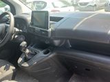the interior of a car with a cell phone in the center of it