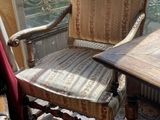 a chair and a table in a room with a view