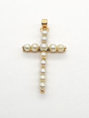 pearl cross pendant on a white background