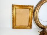 a picture of a picture frame and a clock on a table
