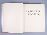 an open book on a blue surface with the title la princesse de clevess
