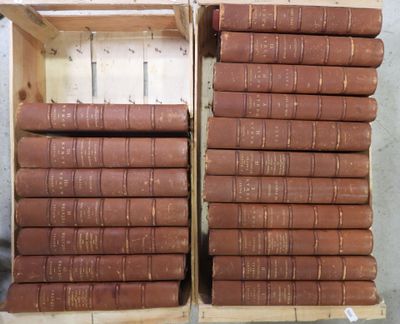 many books stacked on top of each other in a crate